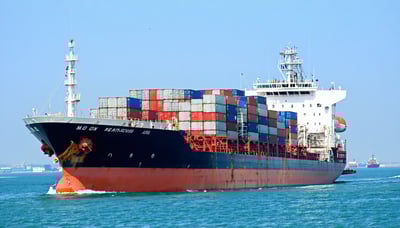 A cargo ship symbolizing international trade and logistics